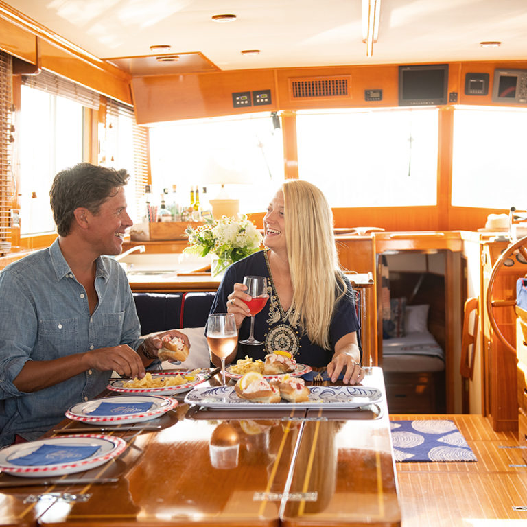 couple enjoying lunch aboard The Liberty